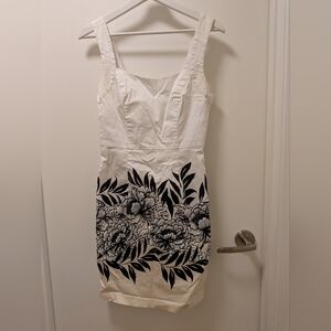 le chateau White Sleeveless Sheath Dress with Black Floral Print